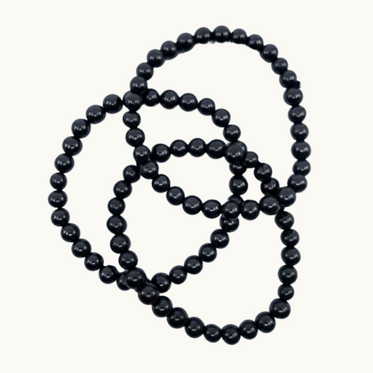 Shungite Beaded Bracelets - Experience clearing and spiritual light with our Shungite bracelets, perfect for purifying the body and dispelling self-sabotaging patterns. Available in 8mm size, each bracelet is uniquely chosen for you.