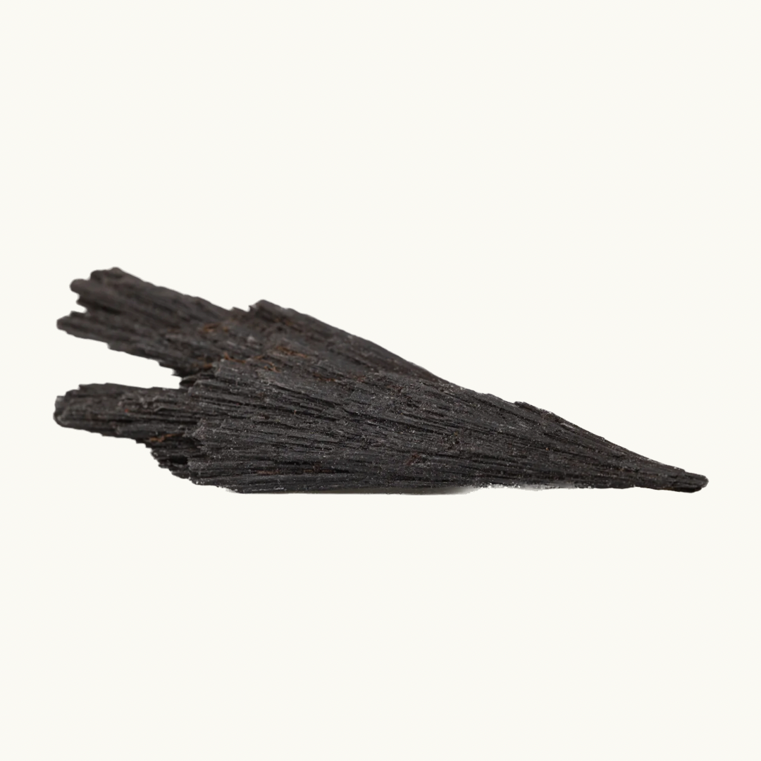 Black Kyanite raw crystals, available in small (1.5") and large (3"+) sizes, handpicked for you by Juniper Stones.