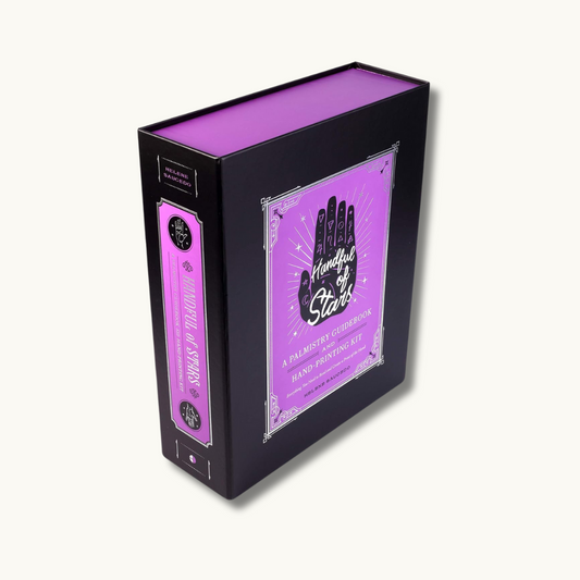 "Handful of Stars Deck" featuring a celestial-themed tarot deck with cosmic illustrations of stars, planets, and constellations depicted on each card.
