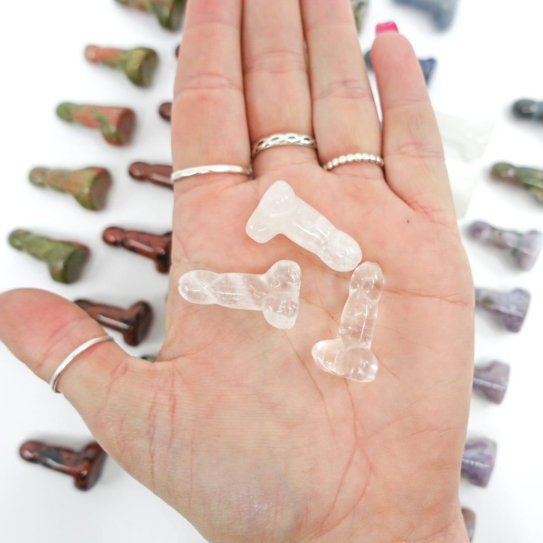 Crystal-shaped phalluses carved from Dalmatian Jasper, Unakite, Clear Quartz, Blue Quartz, Howlite, Moss Agate, and Green Aventurine