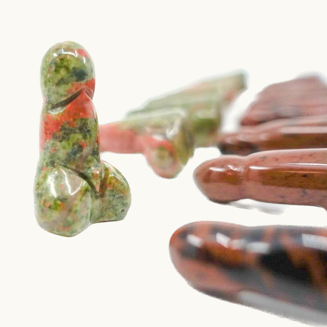 Crystal-shaped phalluses carved from Dalmatian Jasper, Unakite, Clear Quartz, Blue Quartz, Howlite, Moss Agate, and Green Aventurine