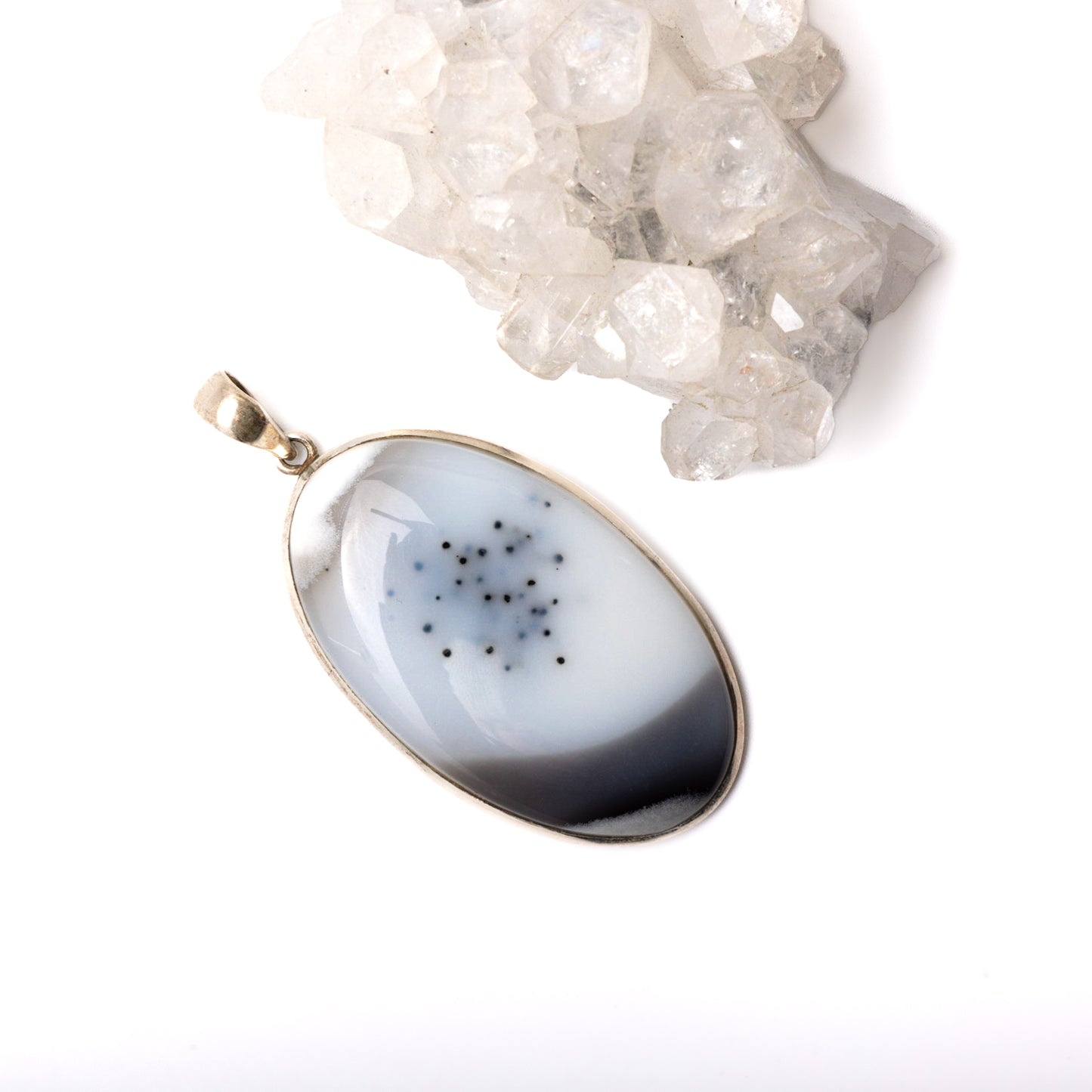 Dendritic Opal Pendant - Experience the magic of life with our Dendritic Opal pendant. Stone roughly measures 2.25". Each pendant is uniquely chosen for you.
