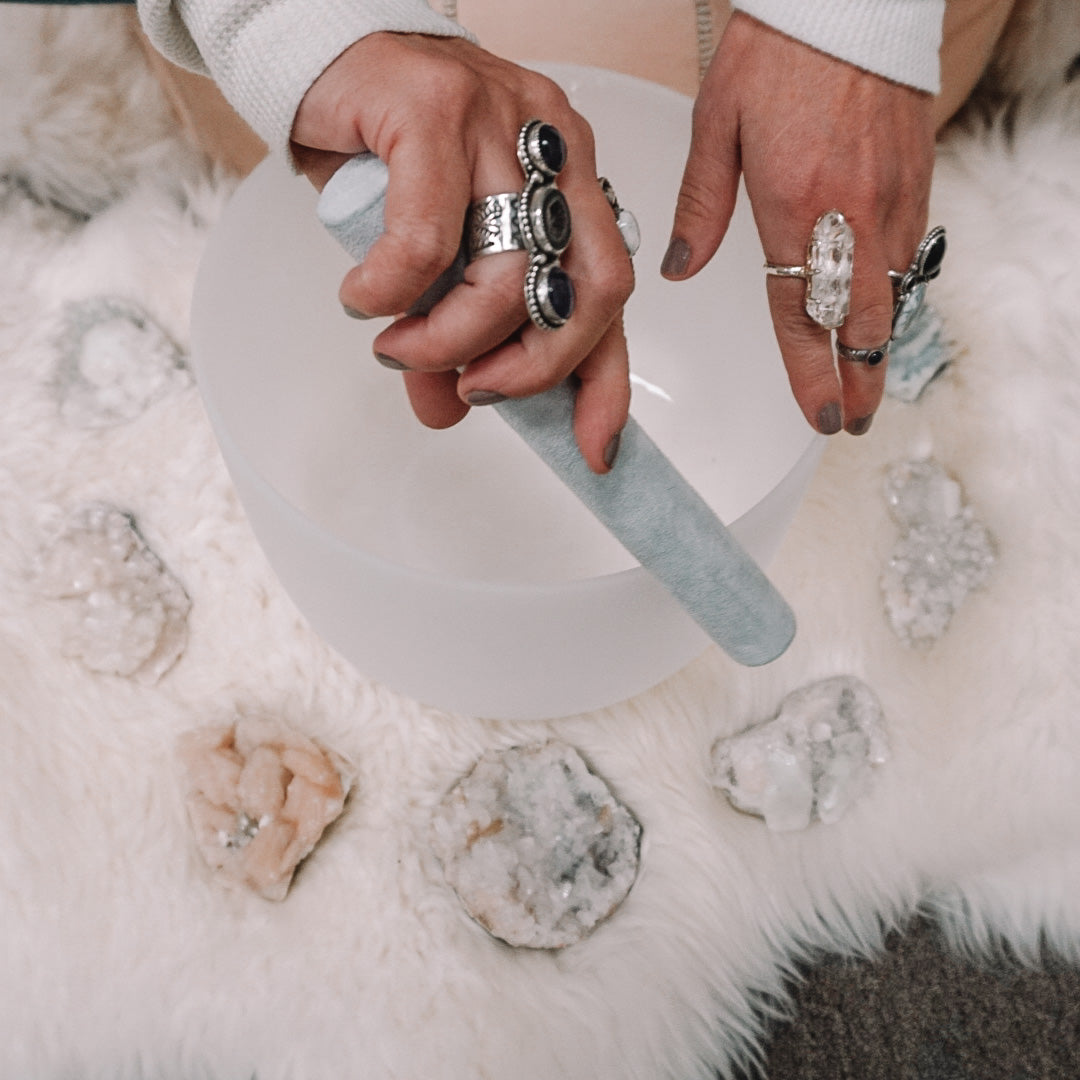 Crystal Sound Bowl Being played + Crystal Jewelry. Shop Meditation tools and Crystal Jewelry