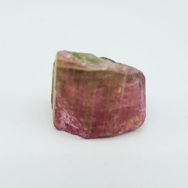 Watermelon tourmaline crystal, approximately measuring 1.5" x 1". Ideal for heart chakra activation, calming energy, and healing. Shapes and sizes may vary.