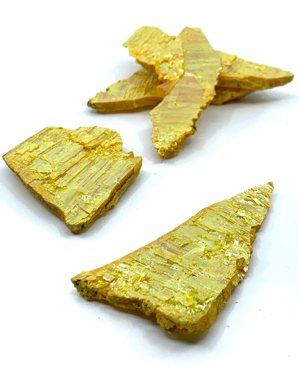 Bright yellow Orpiment mineral. Sizes roughly measuring 3 inches and above